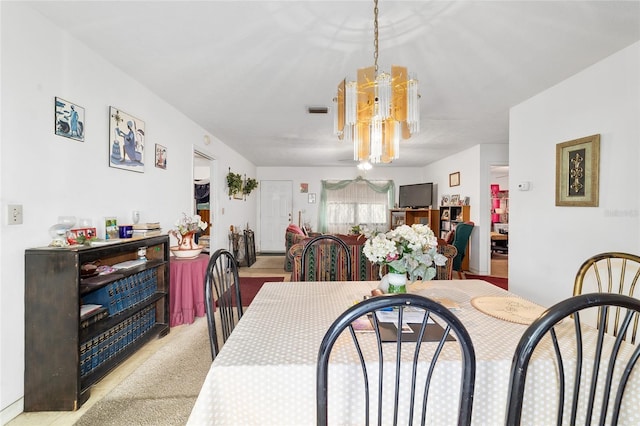 17128 SE 140th Ave, Weirsdale, FL 32195 - dining room featuring a chandelier and carpet floors