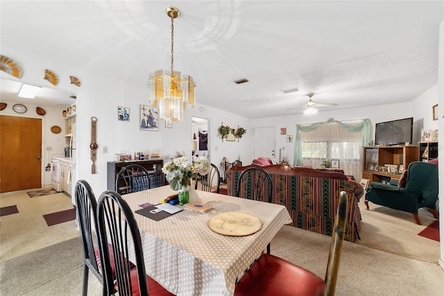 17128 SE 140th Ave, Weirsdale, FL 32195 - dining area with light colored carpet, a chandelier, and a ceiling fan