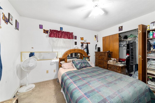 17128 SE 140th Ave, Weirsdale, FL 32195 - bedroom with carpet flooring, a closet, a ceiling fan, and baseboards