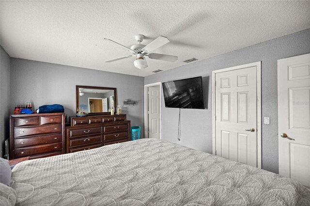 9 Bahia Trace Loop, Ocala, FL 34472 - bedroom featuring a textured ceiling and ceiling fan