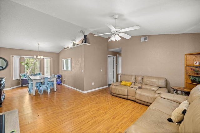 9 Bahia Trace Loop, Ocala, FL 34472 - living area featuring a chandelier, vaulted ceiling, light wood-type flooring, a ceiling fan, and baseboards