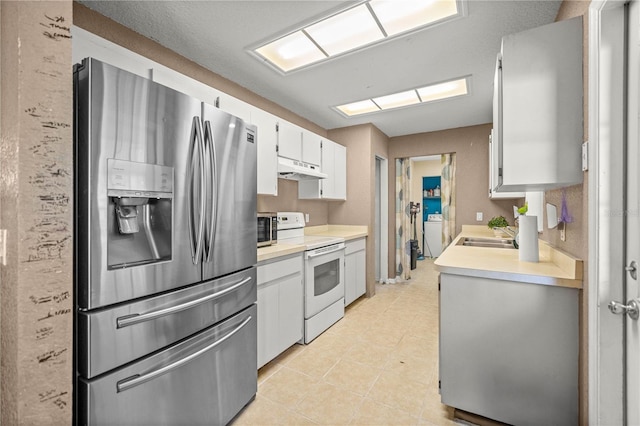 9 Bahia Trace Loop, Ocala, FL 34472 - kitchen featuring stainless steel refrigerator with ice dispenser, white range with electric stovetop, light countertops, white cabinetry, and light tile patterned flooring