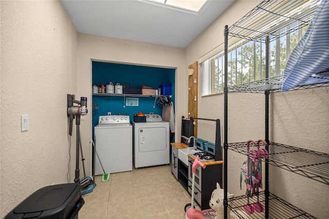 9 Bahia Trace Loop, Ocala, FL 34472 - washroom with a textured wall, separate washer and dryer, and light tile patterned floors