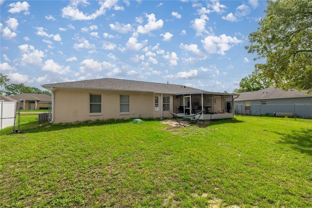 9 Bahia Trace Loop, Ocala, FL 34472 - back of property with a sunroom, stucco siding, and central AC
