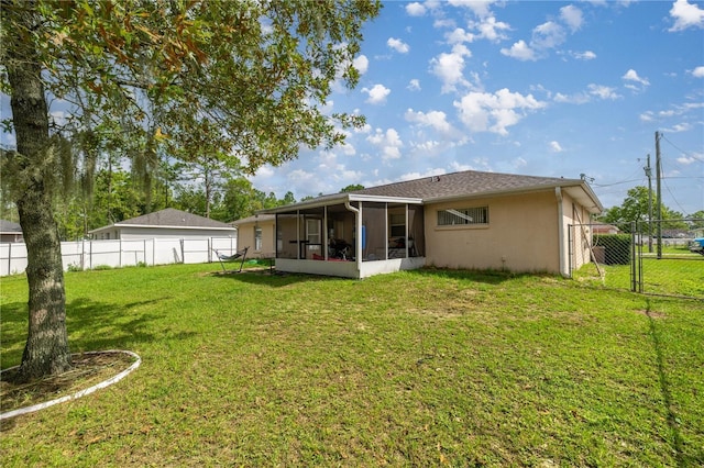 9 Bahia Trace Loop, Ocala, FL 34472 - back of property featuring a sunroom, stucco siding, and a detached garage