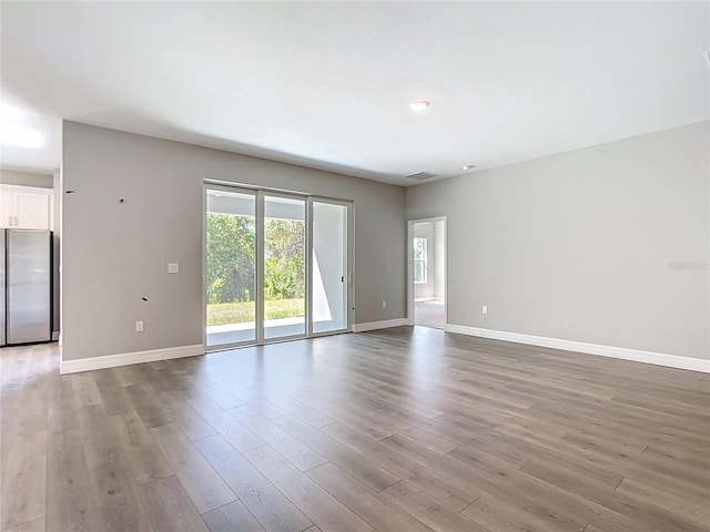 3018 Oceanside St, North Port, FL 34286 - empty room featuring baseboards and wood finished floors