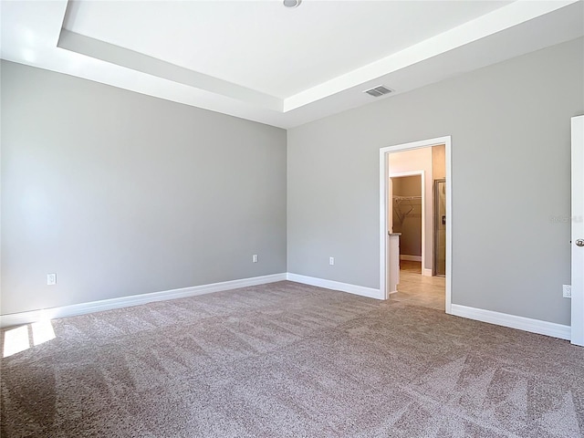 3018 Oceanside St, North Port, FL 34286 - unfurnished room featuring carpet flooring, a raised ceiling, and baseboards