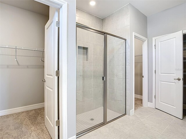 3018 Oceanside St, North Port, FL 34286 - full bath featuring a spacious closet, a stall shower, baseboards, and recessed lighting