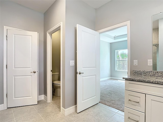 3018 Oceanside St, North Port, FL 34286 - full bathroom with vanity, toilet, baseboards, and tile patterned floors