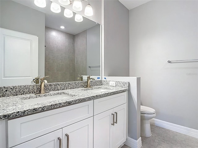 3018 Oceanside St, North Port, FL 34286 - bathroom with double vanity, toilet, baseboards, and tile patterned floors