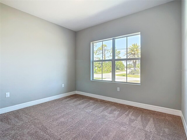 3018 Oceanside St, North Port, FL 34286 - unfurnished room with carpet floors and baseboards
