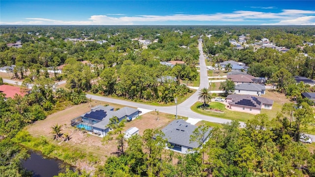 3018 Oceanside St, North Port, FL 34286 - aerial perspective of suburban area with a pool area