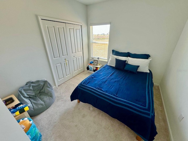 9253 SW 58th Cir, Ocala, FL 34476 - bedroom featuring carpet, a closet, and baseboards