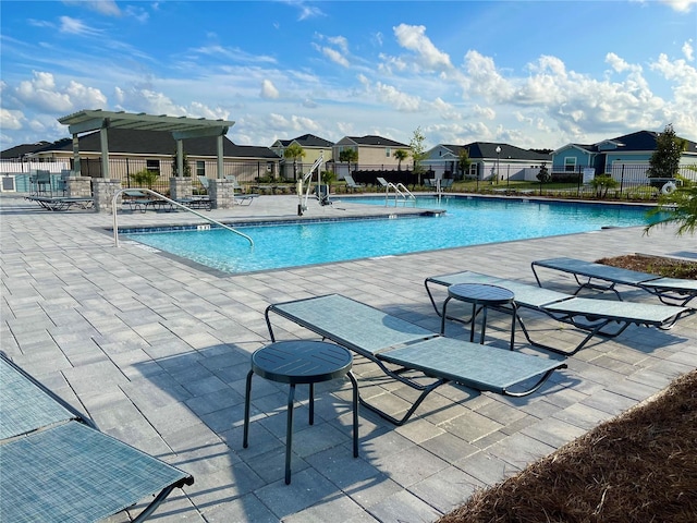 9253 SW 58th Cir, Ocala, FL 34476 - community pool with a residential view and a patio