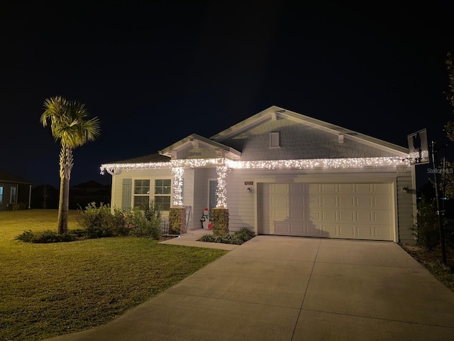 9253 SW 58th Cir, Ocala, FL 34476 - view of front of home featuring driveway, an attached garage, and a yard
