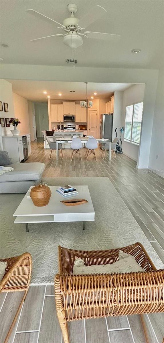 9253 SW 58th Cir, Ocala, FL 34476 - living area with light wood-type flooring, a ceiling fan, and recessed lighting