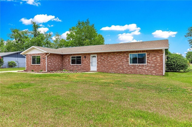 6989 SE 52nd Pl, Ocala, FL 34472 - ranch-style home with a front lawn and brick siding