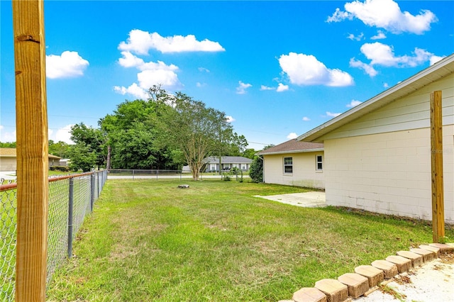 6989 SE 52nd Pl, Ocala, FL 34472 - view of yard featuring a patio