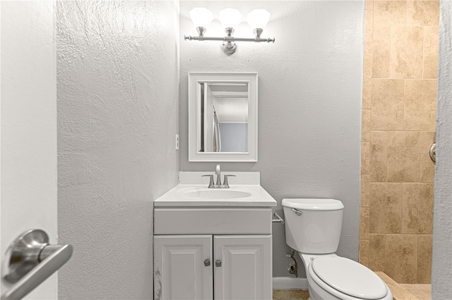 6989 SE 52nd Pl, Ocala, FL 34472 - full bathroom with toilet, vanity, a tile shower, and a textured wall