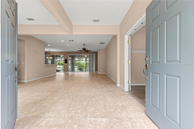 8961 SE 130th Loop, Summerfield, FL 34491 - foyer with a ceiling fan, light tile patterned flooring, and baseboards