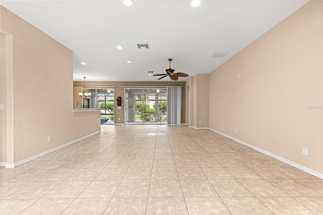 8961 SE 130th Loop, Summerfield, FL 34491 - unfurnished living room featuring recessed lighting, ceiling fan, a chandelier, baseboards, and light tile patterned floors