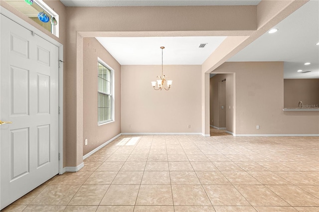 8961 SE 130th Loop, Summerfield, FL 34491 - entryway with a chandelier, light tile patterned floors, recessed lighting, and baseboards