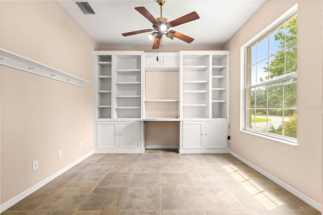 8961 SE 130th Loop, Summerfield, FL 34491 - spare room featuring healthy amount of natural light, a ceiling fan, and baseboards