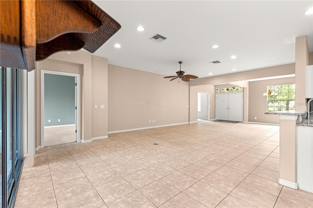 8961 SE 130th Loop, Summerfield, FL 34491 - unfurnished living room with a ceiling fan, light tile patterned floors, recessed lighting, and baseboards