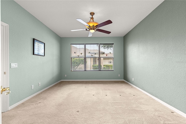 8961 SE 130th Loop, Summerfield, FL 34491 - spare room featuring a textured wall, carpet flooring, a ceiling fan, and baseboards