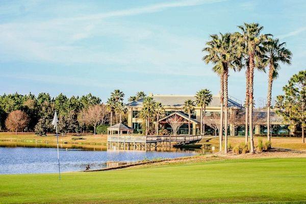 8961 SE 130th Loop, Summerfield, FL 34491 - view of property's community with a water view, a lawn, and a gazebo