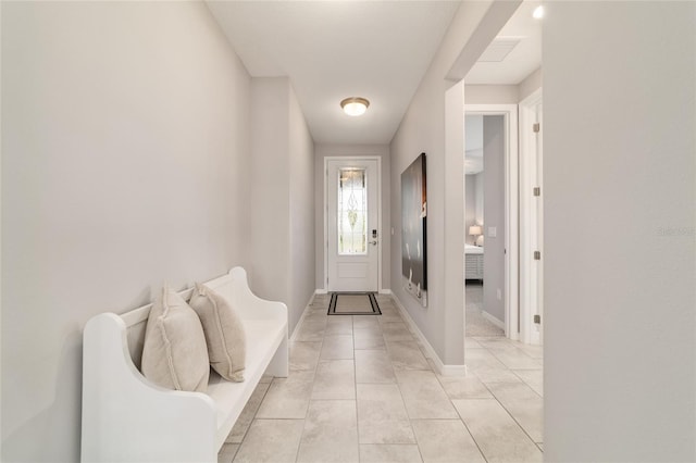 5651 NW 40th Pl, Ocala, FL 34482 - foyer featuring baseboards and light tile patterned flooring