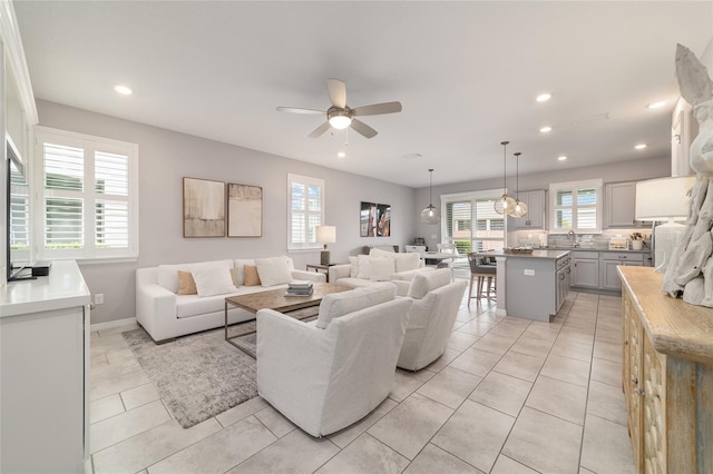 5651 NW 40th Pl, Ocala, FL 34482 - living room featuring ceiling fan, recessed lighting, light tile patterned floors, and baseboards
