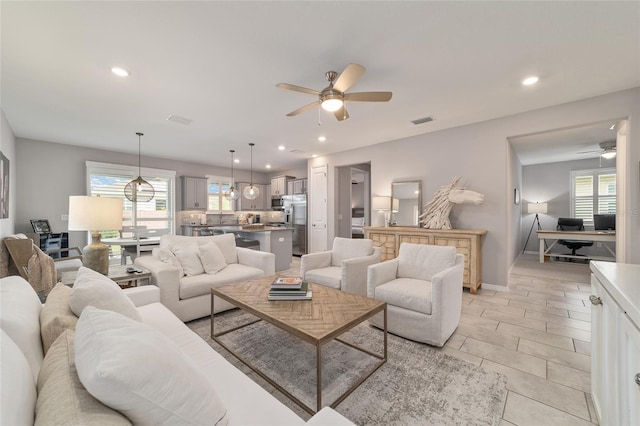 5651 NW 40th Pl, Ocala, FL 34482 - living area with ceiling fan, healthy amount of natural light, recessed lighting, baseboards, and light tile patterned floors