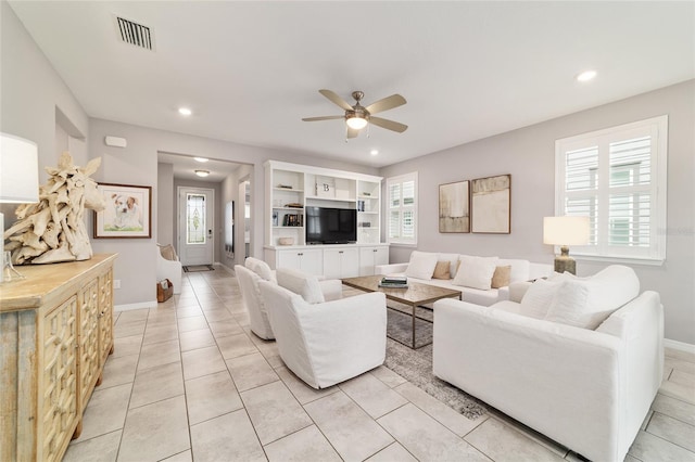 5651 NW 40th Pl, Ocala, FL 34482 - living area with ceiling fan, recessed lighting, light tile patterned floors, and baseboards