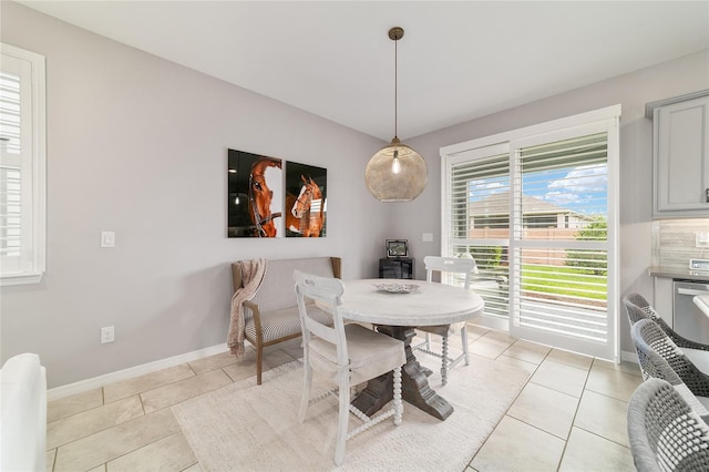 5651 NW 40th Pl, Ocala, FL 34482 - dining area with light tile patterned floors and baseboards