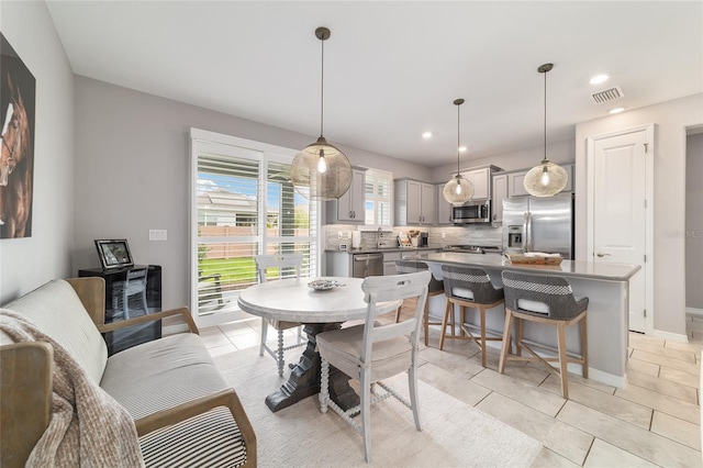 5651 NW 40th Pl, Ocala, FL 34482 - dining room with light tile patterned floors, recessed lighting, and baseboards