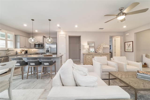 5651 NW 40th Pl, Ocala, FL 34482 - living area with ceiling fan, recessed lighting, and light tile patterned floors