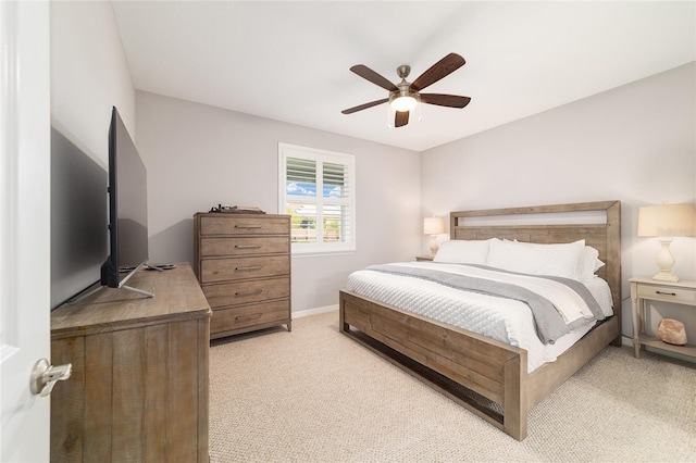 5651 NW 40th Pl, Ocala, FL 34482 - bedroom featuring light carpet, ceiling fan, and baseboards