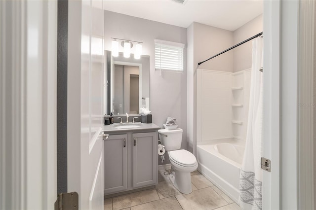 5651 NW 40th Pl, Ocala, FL 34482 - bathroom featuring vanity, shower / bathtub combination with curtain, toilet, and tile patterned flooring