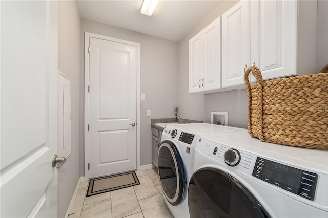 5651 NW 40th Pl, Ocala, FL 34482 - laundry room featuring cabinet space, separate washer and dryer, baseboards, and light tile patterned floors