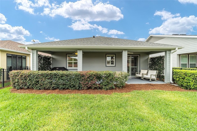 5651 NW 40th Pl, Ocala, FL 34482 - back of house with a porch and roof with shingles