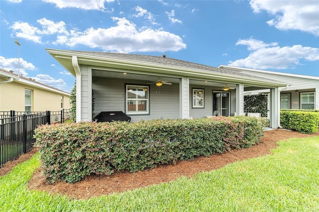 5651 NW 40th Pl, Ocala, FL 34482 - view of front facade featuring a ceiling fan and roof with shingles