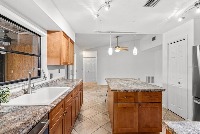 9606 N Caressa Way, Citrus Springs, FL 34434 - kitchen with a sink, ceiling fan, track lighting, a kitchen island, and stainless steel appliances