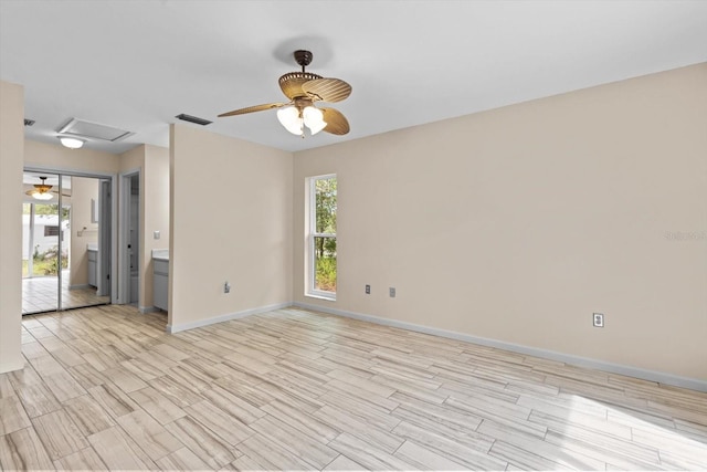 9606 N Caressa Way, Citrus Springs, FL 34434 - unfurnished room featuring a ceiling fan, wood finish floors, attic access, and baseboards