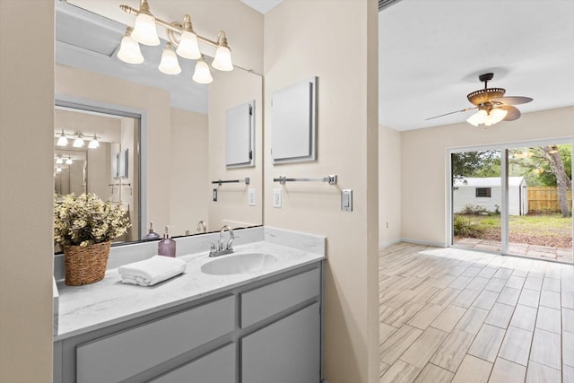 9606 N Caressa Way, Citrus Springs, FL 34434 - bathroom featuring vanity, ceiling fan, and baseboards