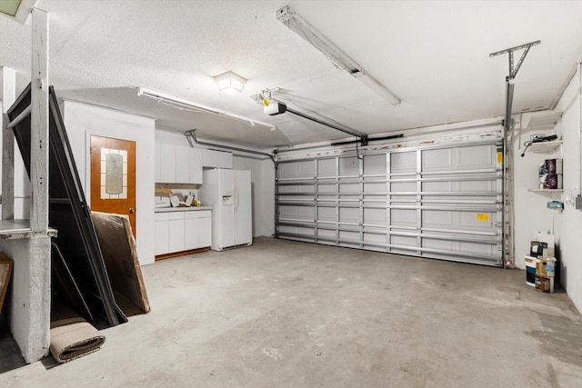 9606 N Caressa Way, Citrus Springs, FL 34434 - garage with white fridge with ice dispenser and a garage door opener