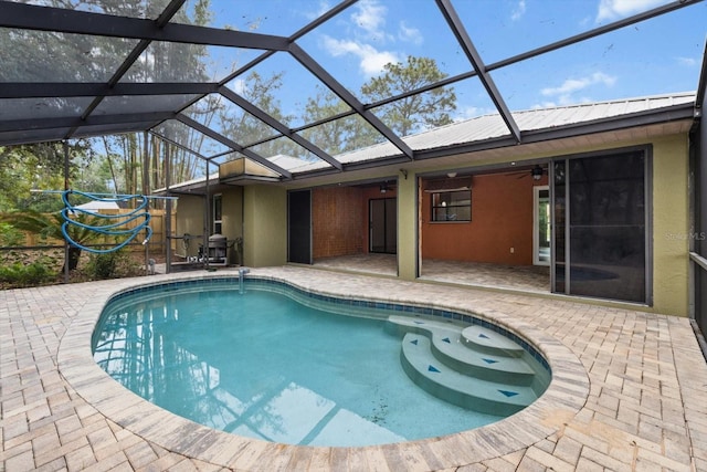 9606 N Caressa Way, Citrus Springs, FL 34434 - swimming pool featuring a patio area, ceiling fan, and glass enclosure