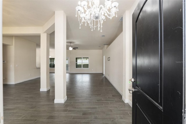 10910 SW 41st Ave, Ocala, FL 34476 - entrance foyer with dark wood-type flooring, baseboards, ceiling fan, and a chandelier