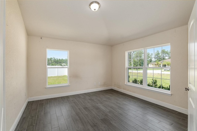 10910 SW 41st Ave, Ocala, FL 34476 - unfurnished room with plenty of natural light, dark wood finished floors, and baseboards
