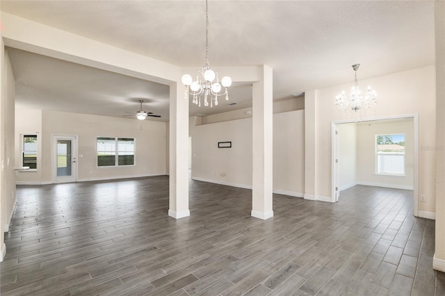 10910 SW 41st Ave, Ocala, FL 34476 - unfurnished living room featuring a chandelier, dark wood-type flooring, and baseboards